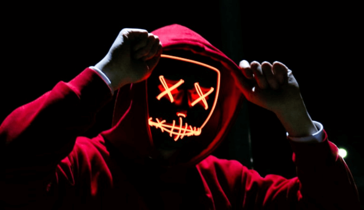 hacker with hoodie and face made of lights